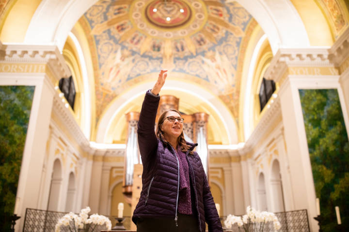 Victoria Young, Professor and Chair of Art History, speaks to members of the University of St. Thomas’ board of trustees, campus ministry, and lead donors about the renovations made to the Chapel of St. Thomas Aquinas following a construction site hard-hat tour of the Iversen Center for Faith on the St. Paul campus on November 13, 2019.